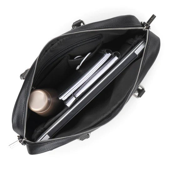 Black leather briefcase with a laptop and cylindrical object on a white background