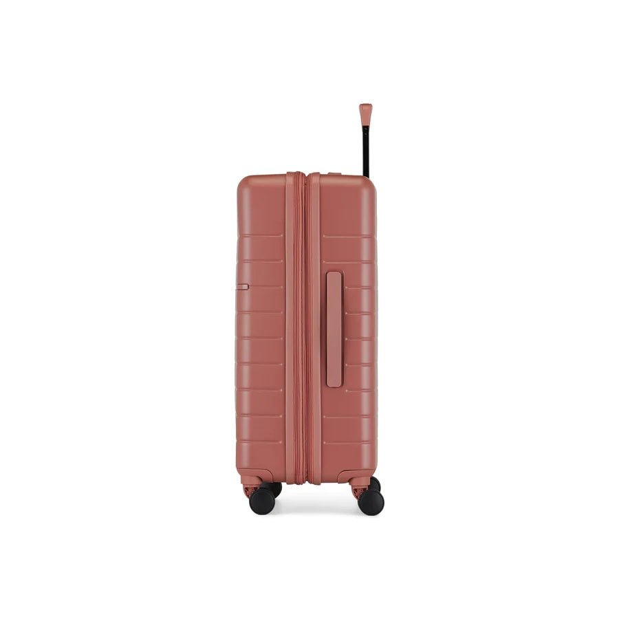 Brown suitcase with wheels on a white background