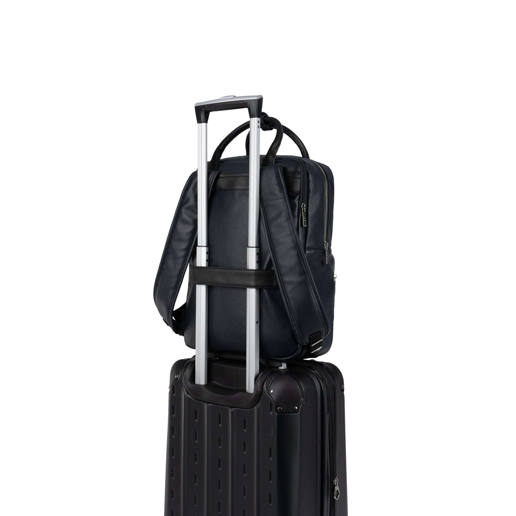 Black suitcase with a backpack on top on a white background