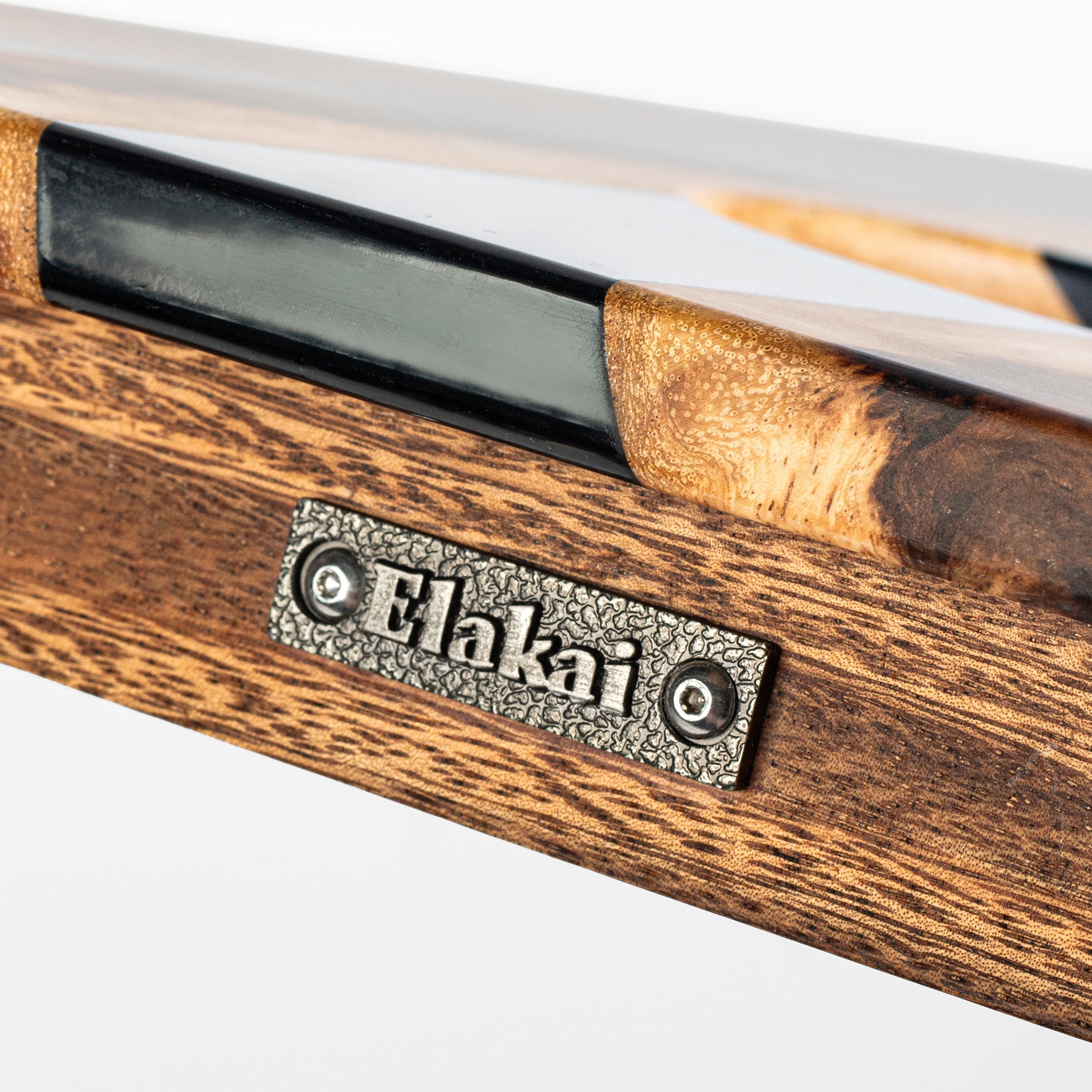 Wooden knife handle with 'Elakai' branding on a white background