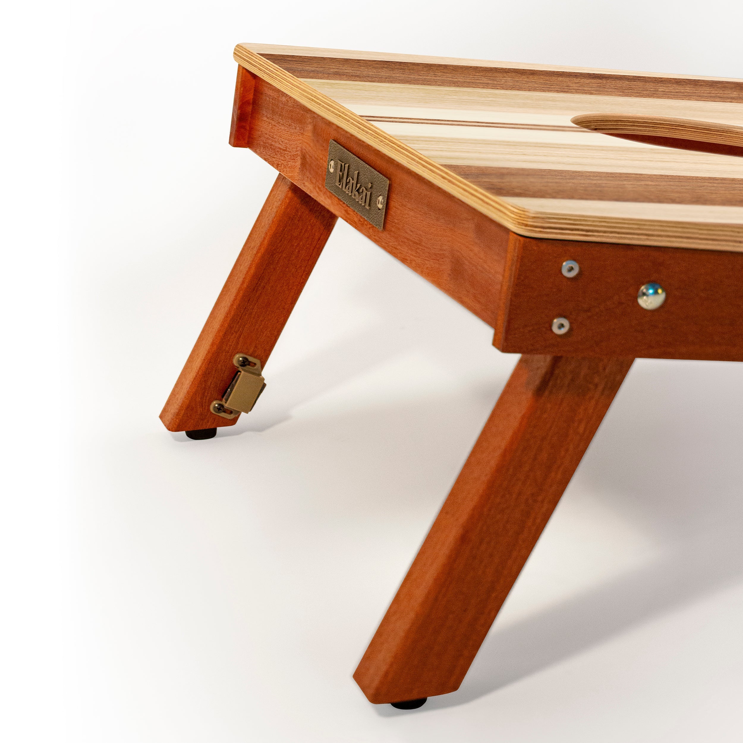Wooden pet bed with a brand name tag on a white background