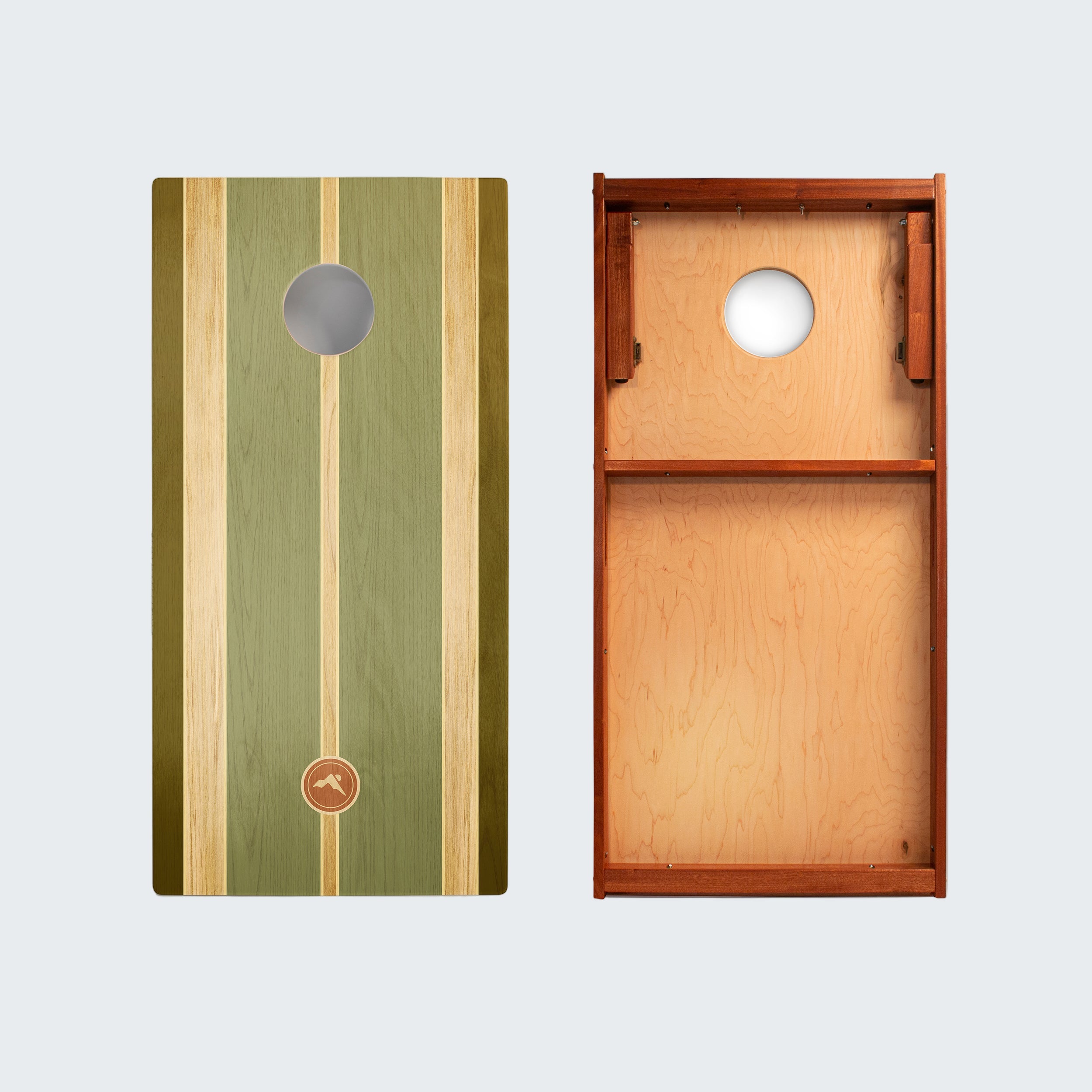 Two wooden cornhole boards with green and brown design on a white background