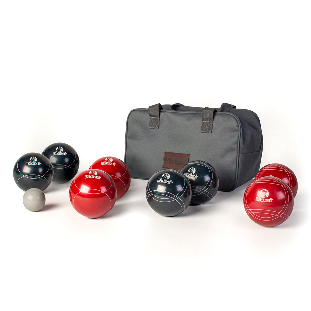 Set of red and black boules with a gray carrying bag on a white background