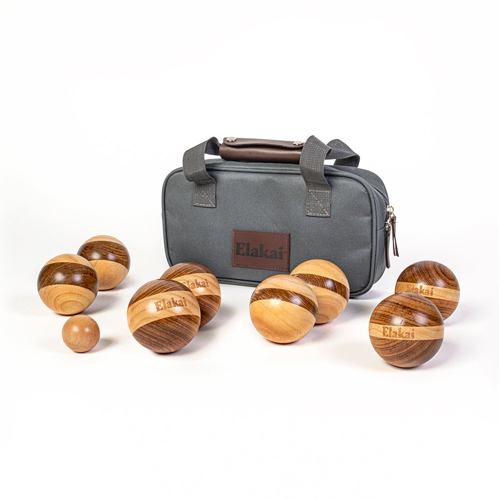 Wooden balls with 'Elakat' branding and a gray carrying case on a white background