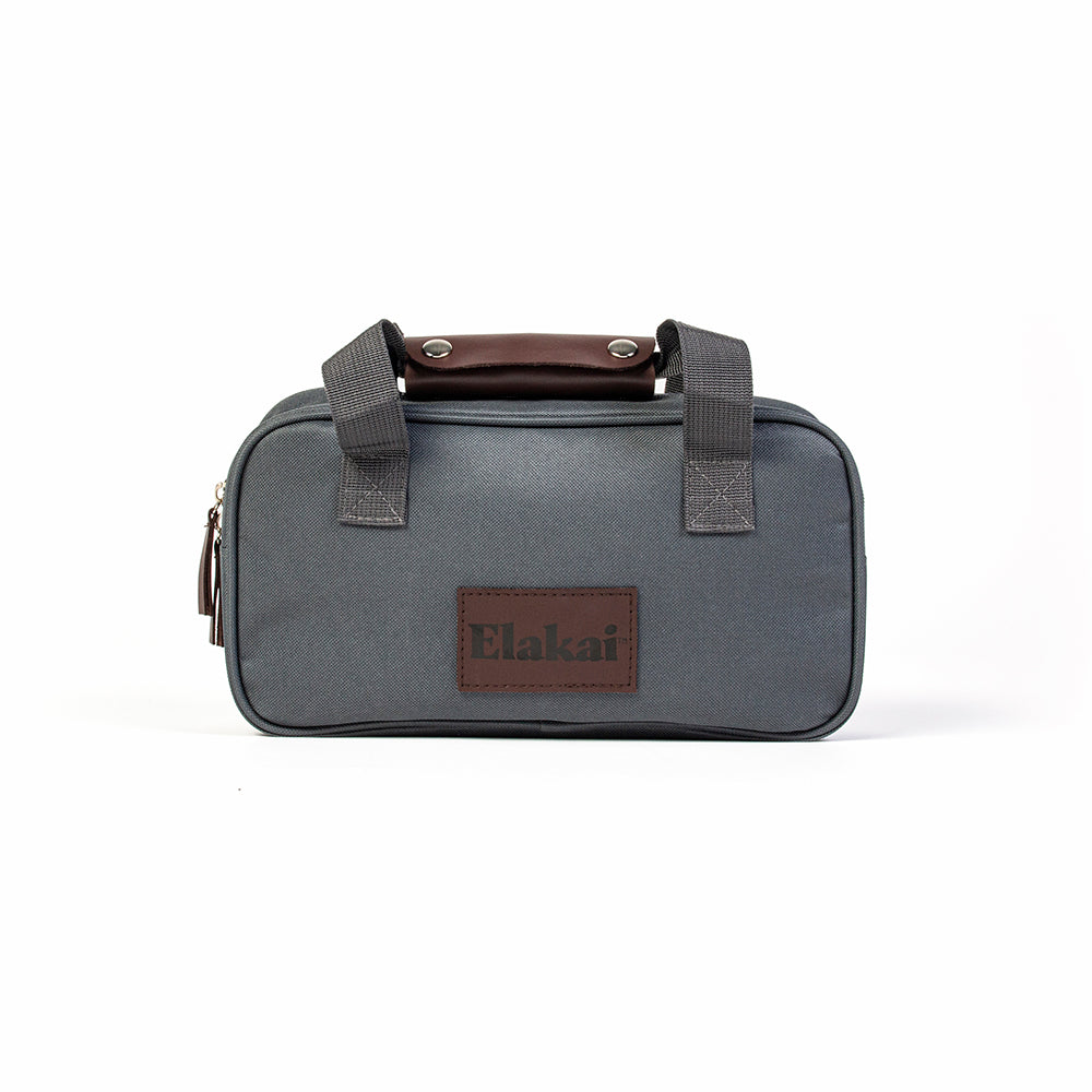 Gray toiletry bag with brown accents and a visible brand logo on a white background