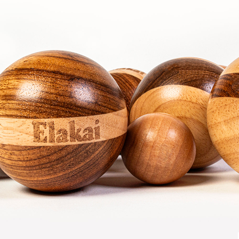 Wooden massage ball set with 'Elakai' branding on a white background