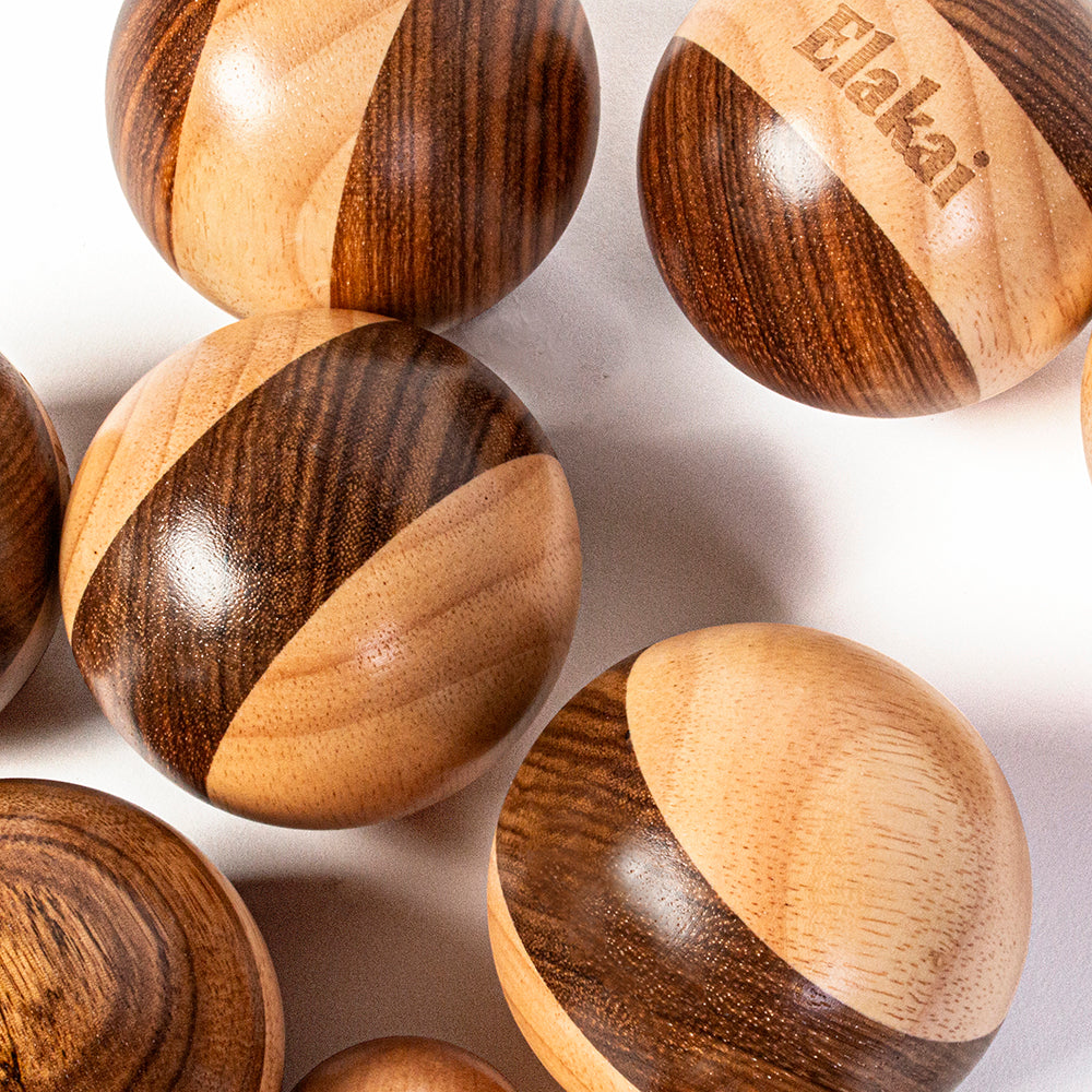 Wooden beads with a visible brand name on a light background