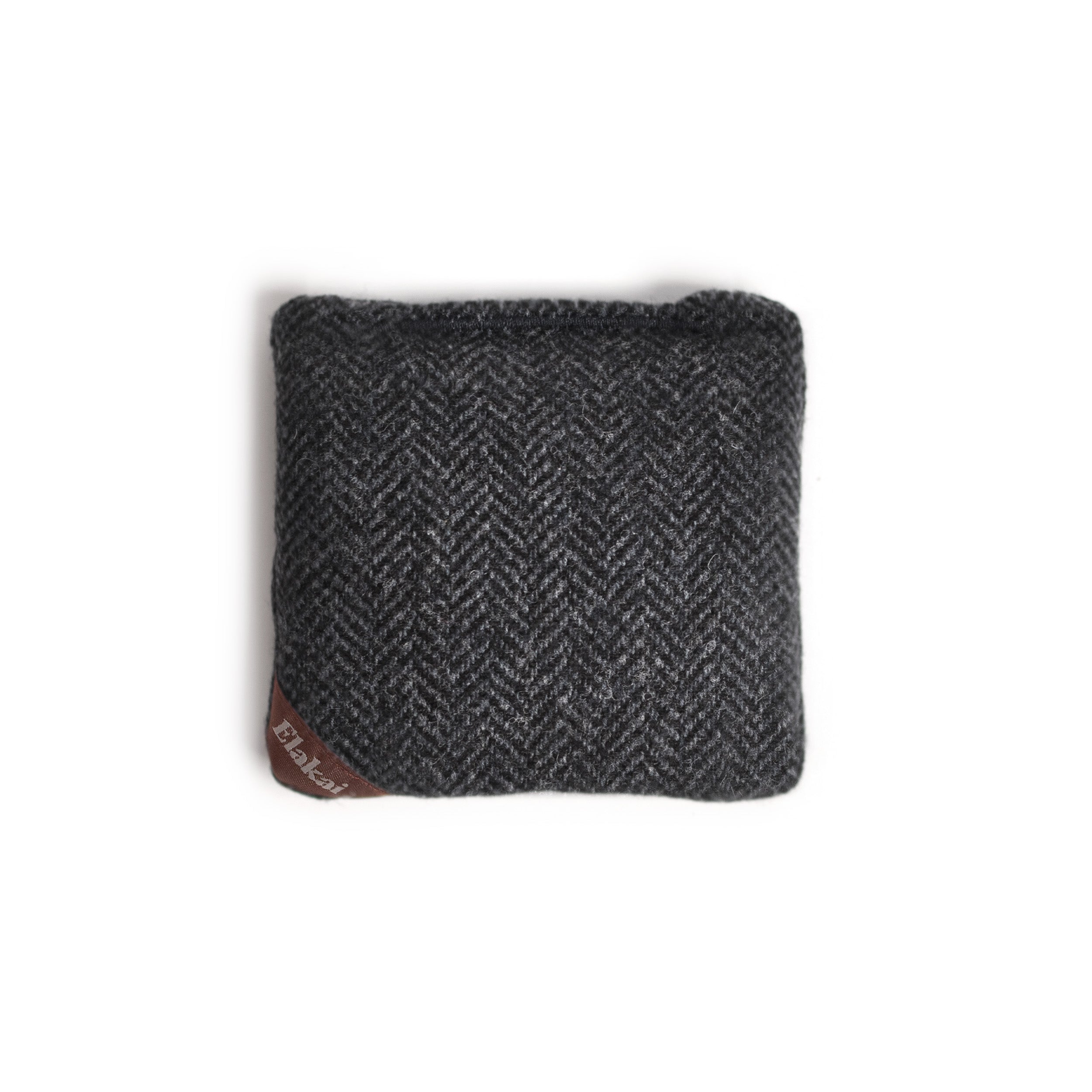 Dark gray herringbone fabric square with a brand label on a white background