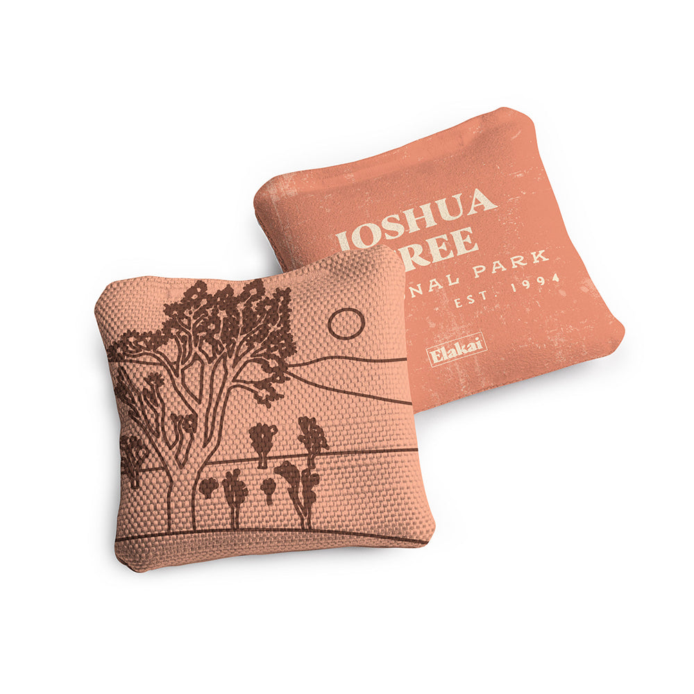 Two decorative pillows with 'Joshua Ree' branding on a white background