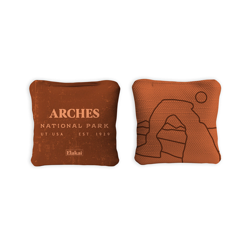 Two brown bean bags with Arches National Park branding on a white background