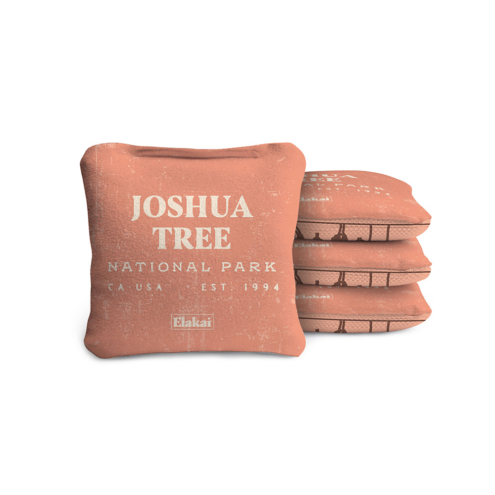 Red brick-shaped pillow with 'Joshua Tree National Park' text on a white background
