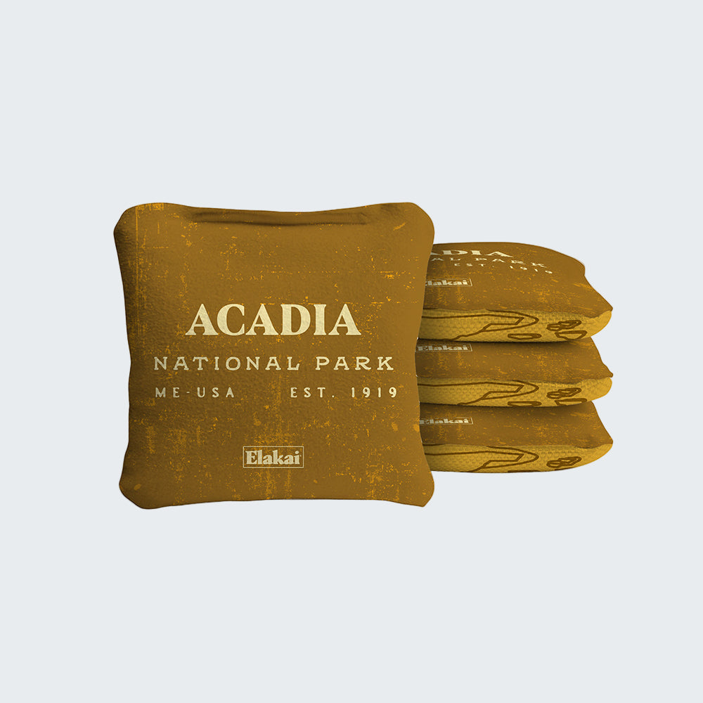 Stack of brown bean bags with 'Acadia National Park' text on a white background