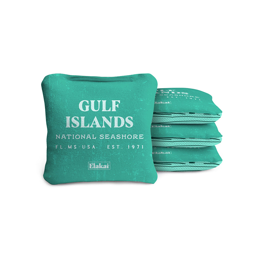 Stack of teal bean bags with 'Gulf Islands National Seashore' text on a white background
