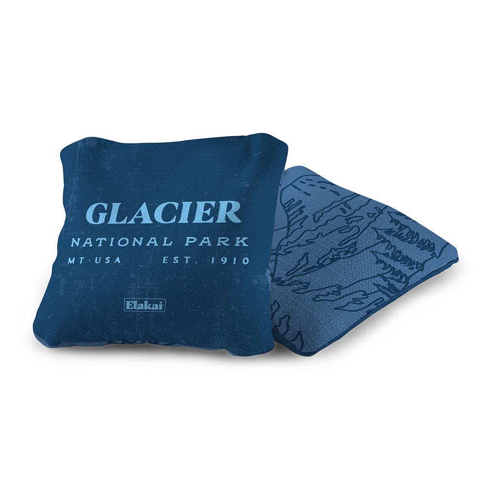 Blue pillow with 'Glacier National Park' text on a white background