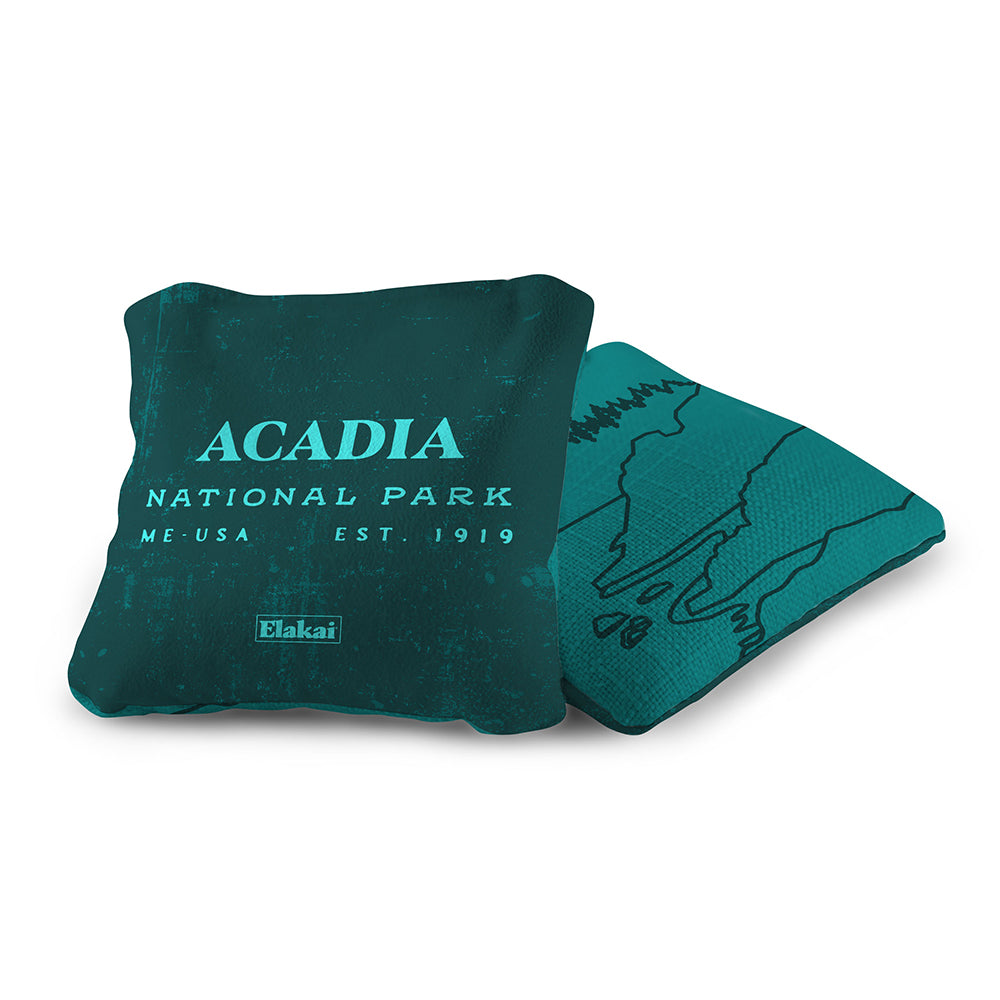 Teal pillow with 'Acadia National Park' text on a white background