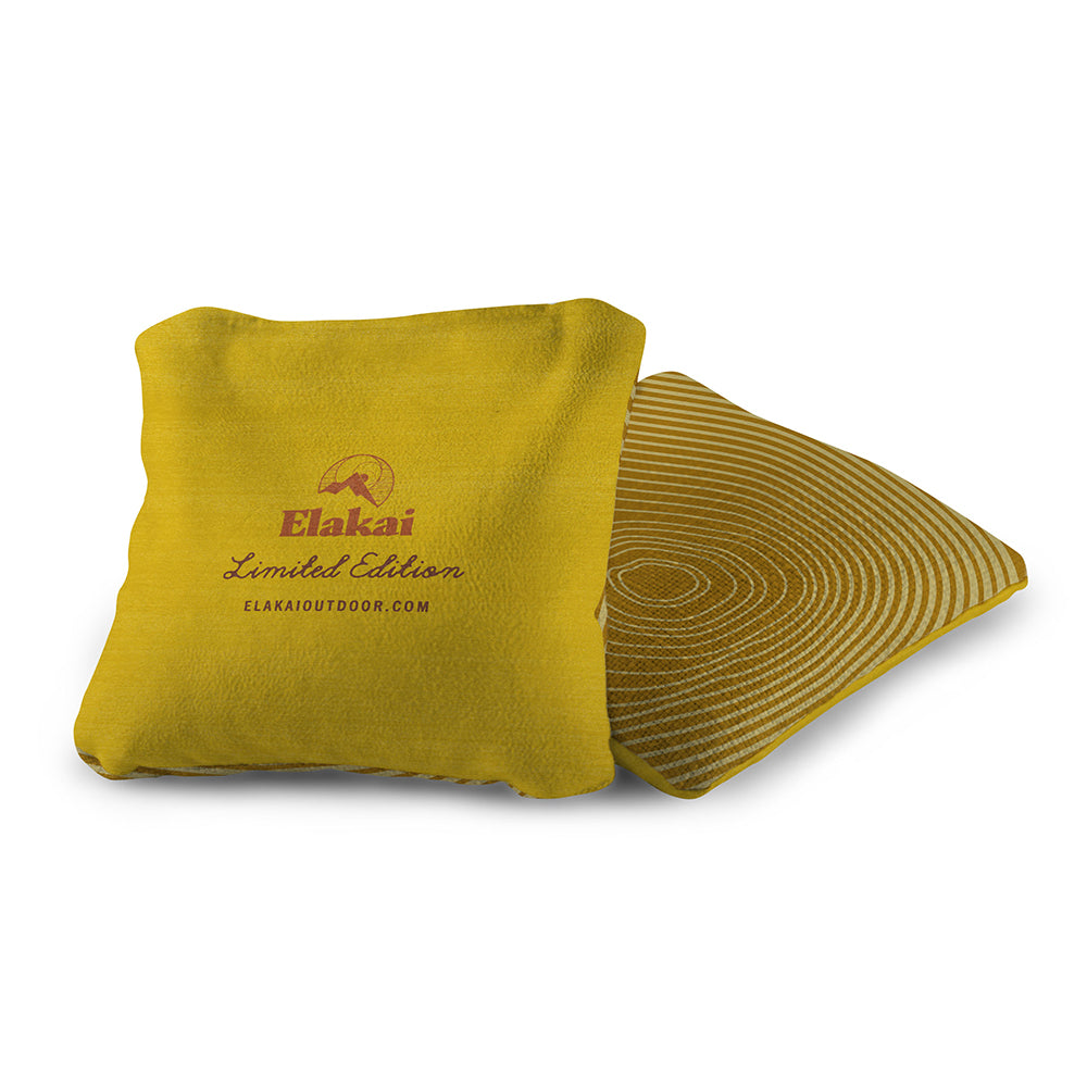 Yellow towel with Elakai branding on a white background