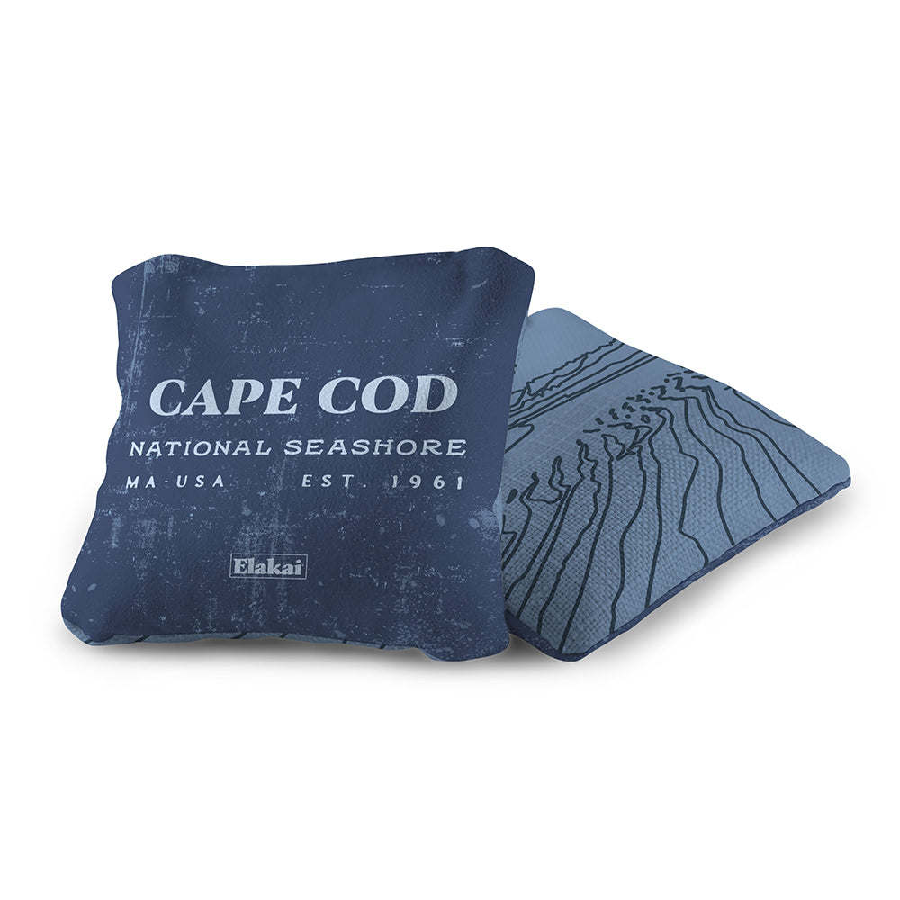 Blue pillow with 'Cape Cod National Seashore' text on a white background