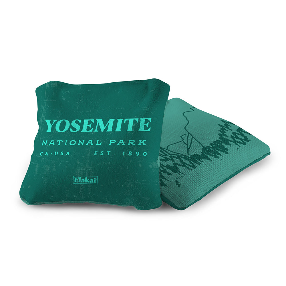 Green pillow with 'Yosemite National Park' text on a white background