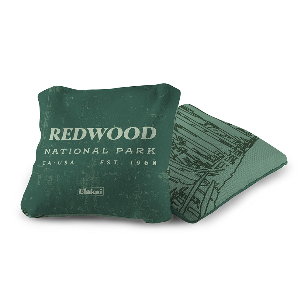 Green pillow with 'Redwood National Park' text on a white background