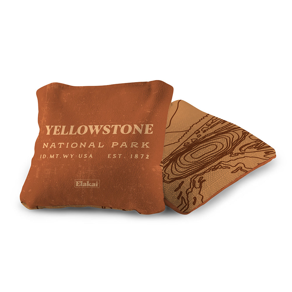 Brown pillow with 'Yellowstone National Park' text on a white background