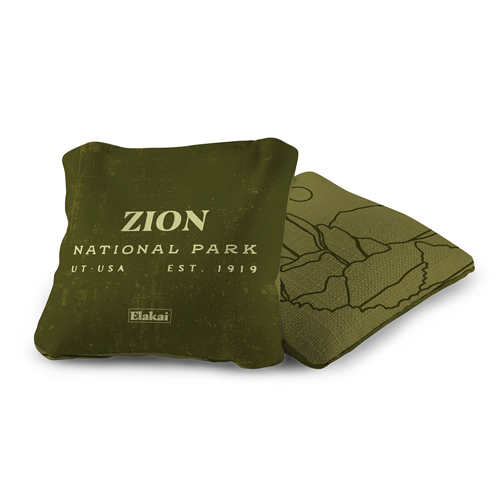 Two green bags with 'Zion National Park' text on a white background