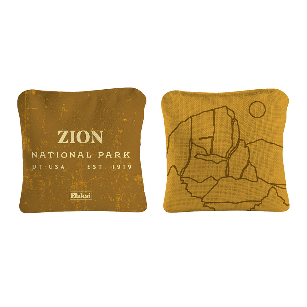 Two mustard yellow pillows with Zion National Park design on a white background