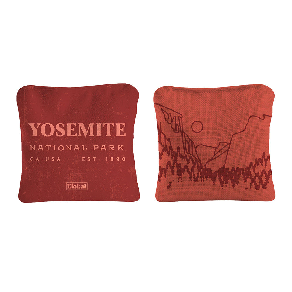 Two red pillows with Yosemite National Park text and design on a white background