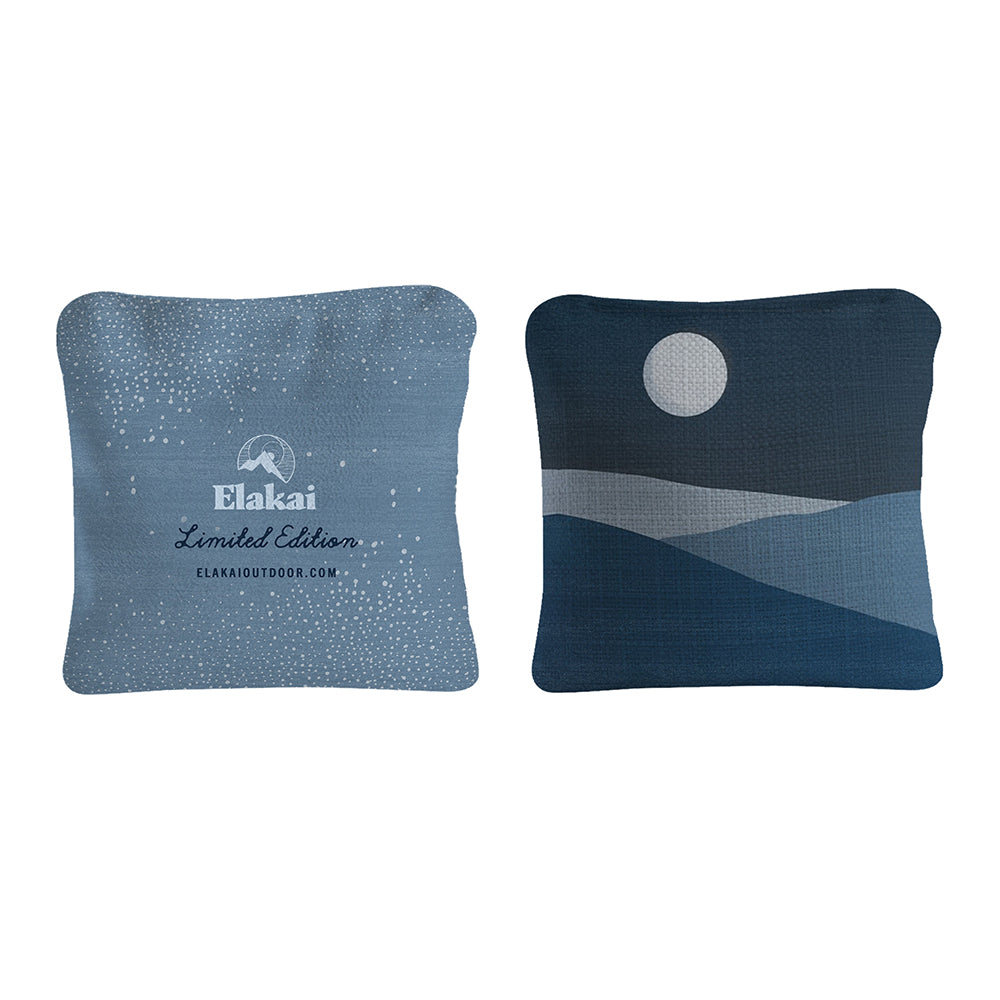 Two blue pillows with Elakai branding on a white background