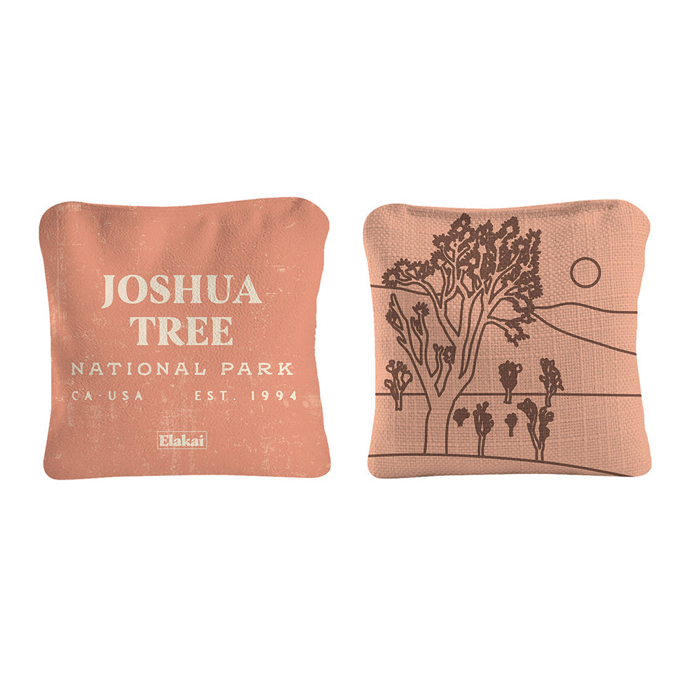 Two decorative pillows with 'Joshua Tree National Park' text and tree design on a white background.