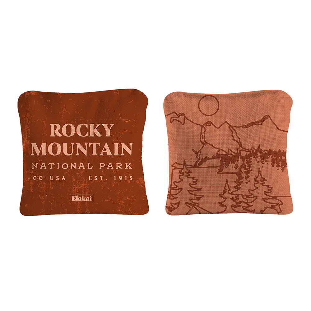 Two decorative pillows with 'Rocky Mountain National Park' text and mountain design on a white background.