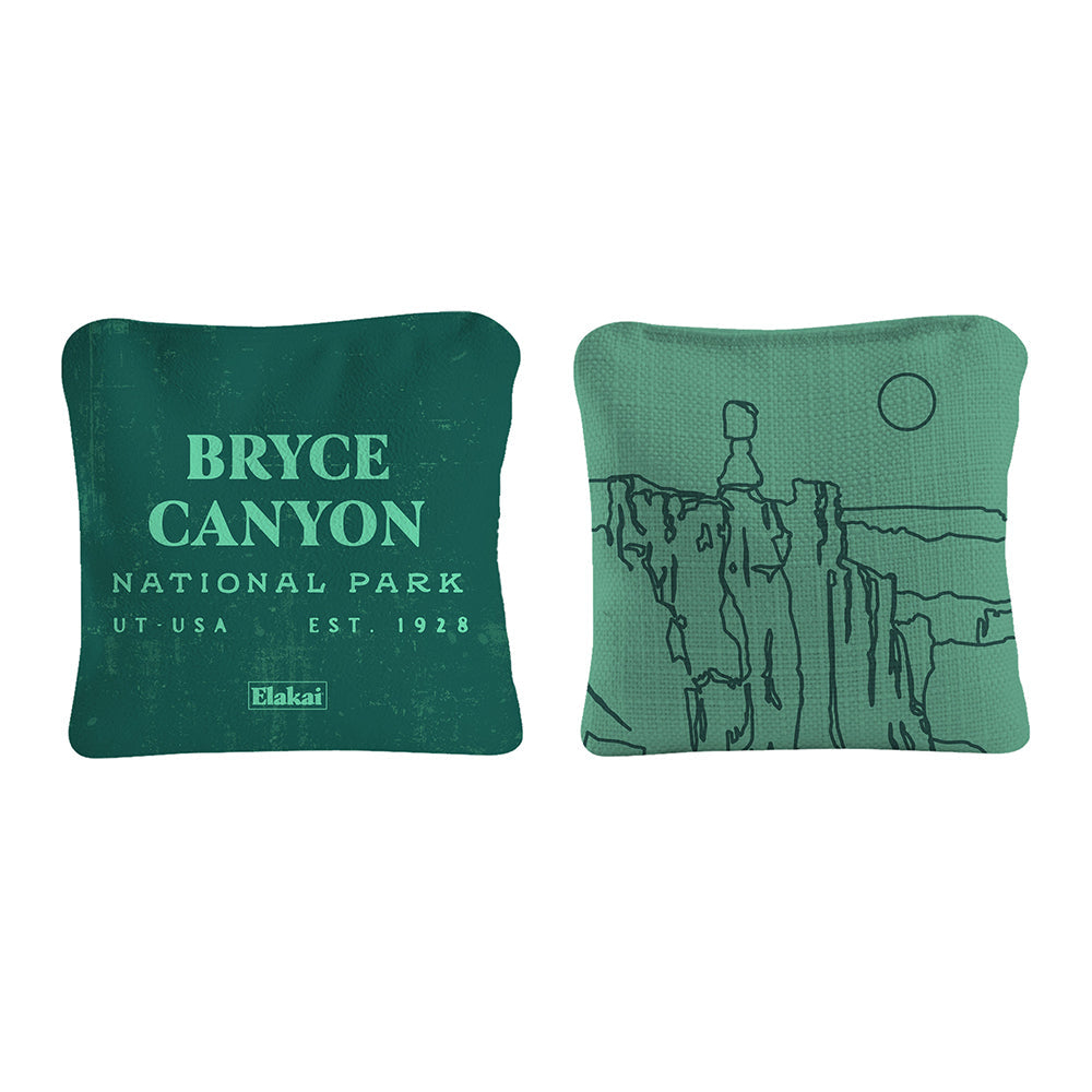 Two green pillows with Bryce Canyon National Park text and illustration on a white background