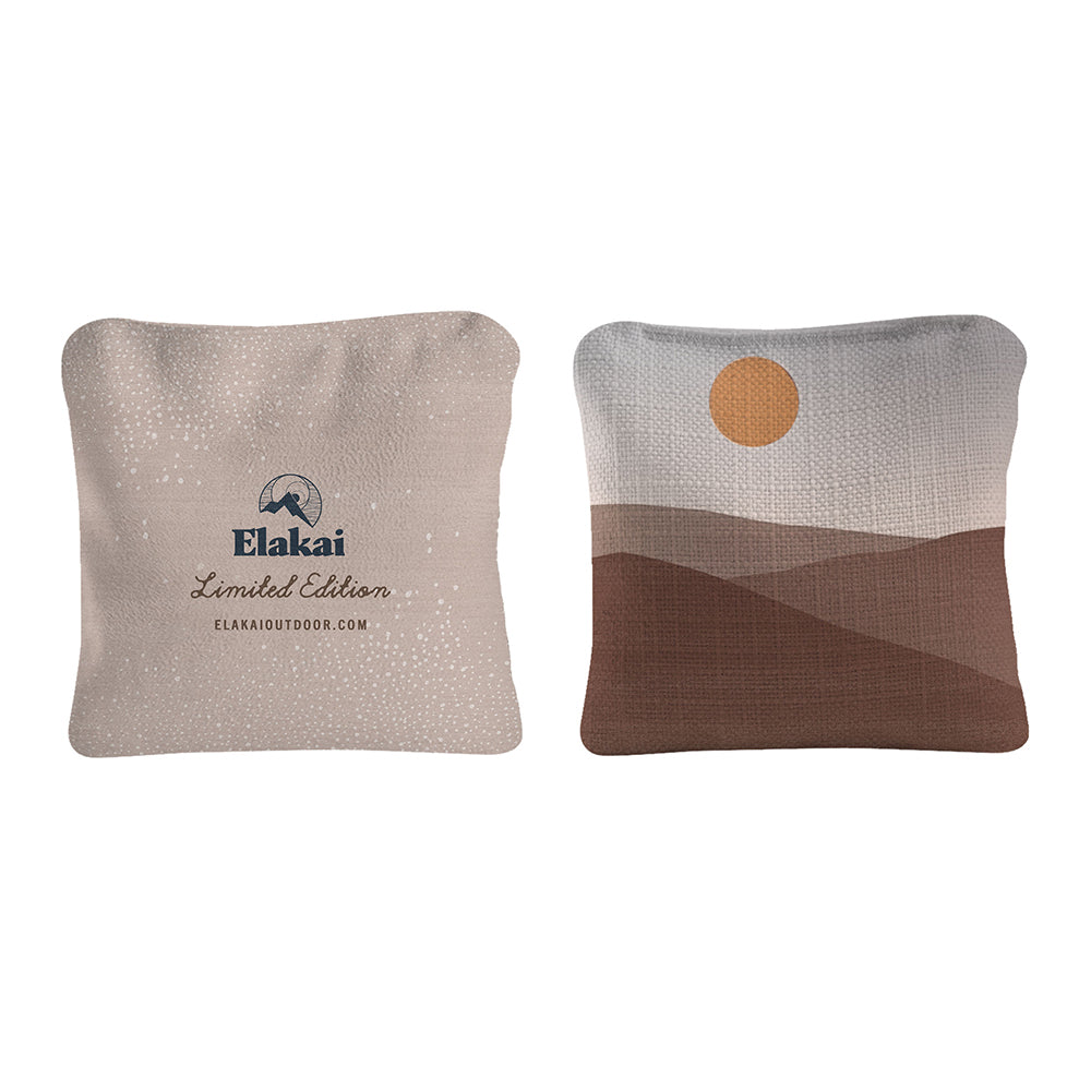 Two decorative pillows with 'Elakai' branding on a white background