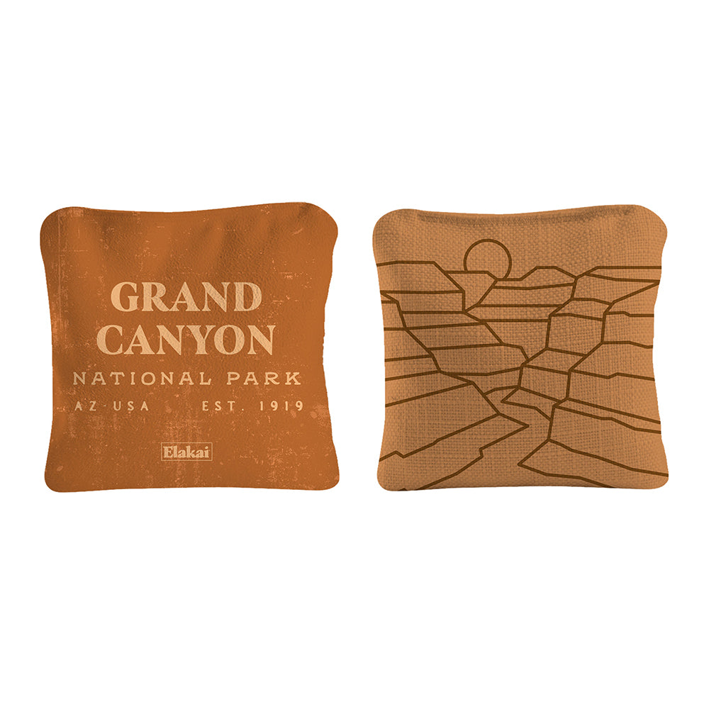 Two decorative pillows with Grand Canyon National Park text and design on a white background