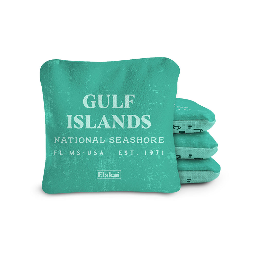 Teal cornhole bags with 'Gulf Islands National Seashore' text on a white background