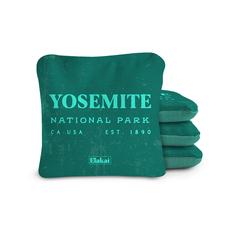 Green pillow with 'Yosemite National Park' text on a white background