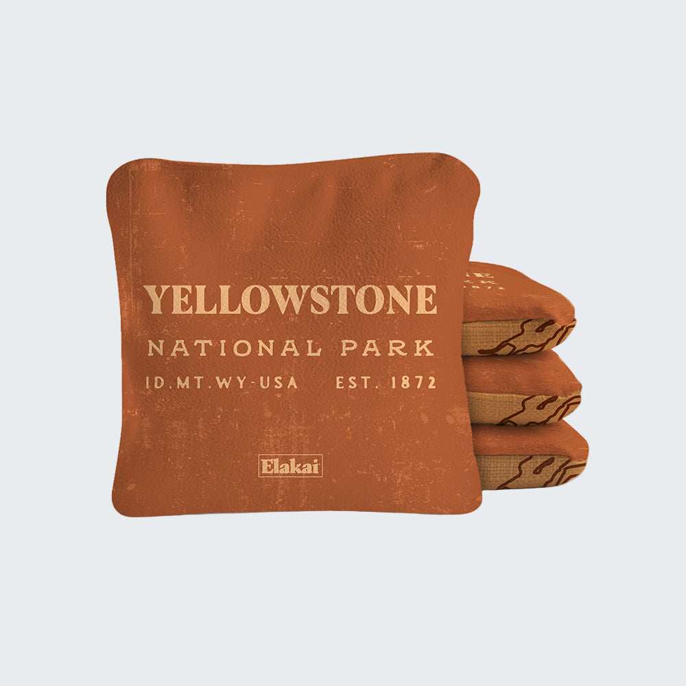Stack of brown Yellowstone National Park blankets with branding on a white background