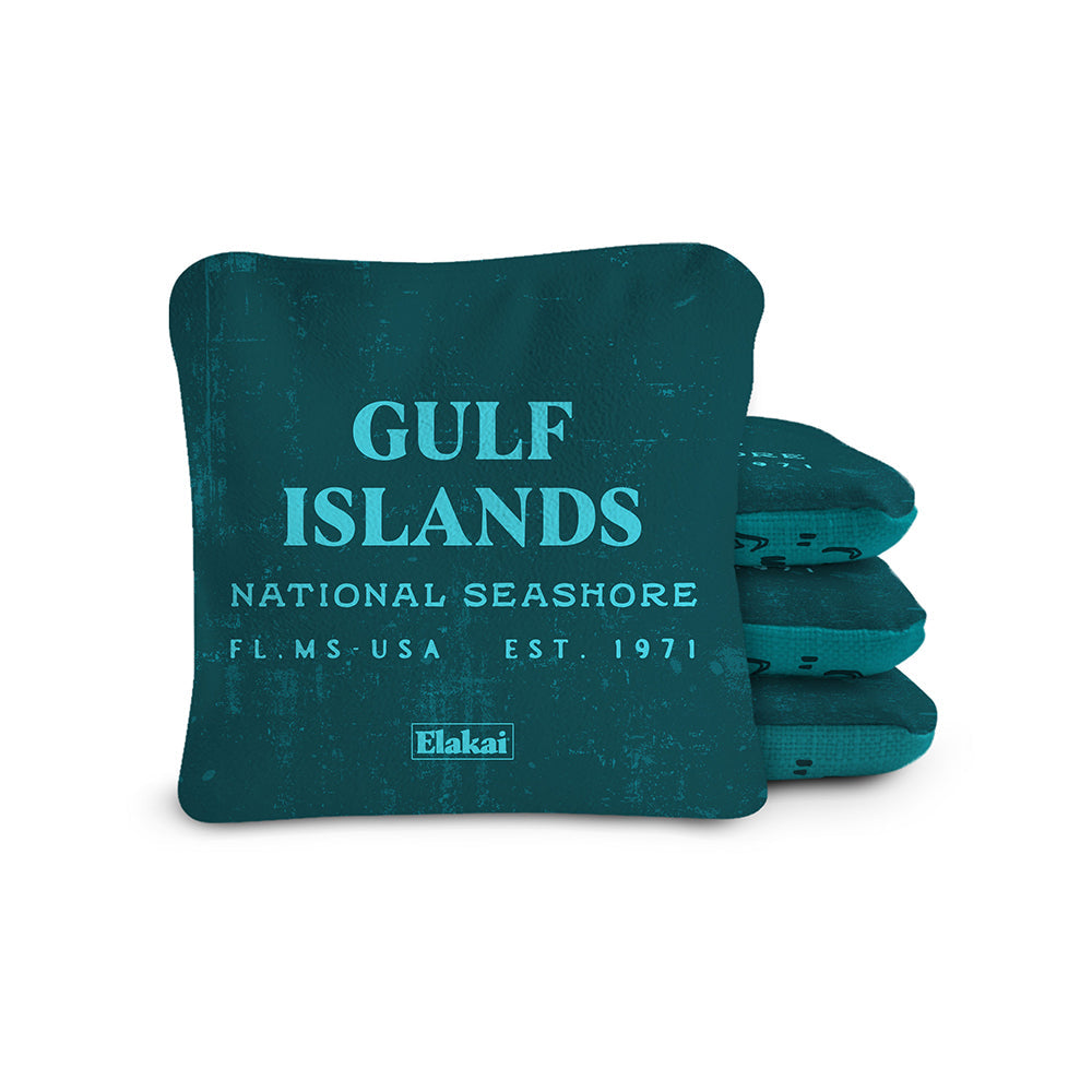 Teal pillow with 'Gulf Islands National Seashore' text and Elakai logo on a white background