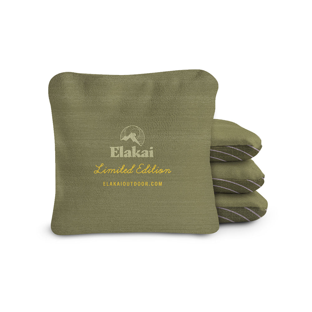 Green cornhole bags with Elakai branding on a white background
