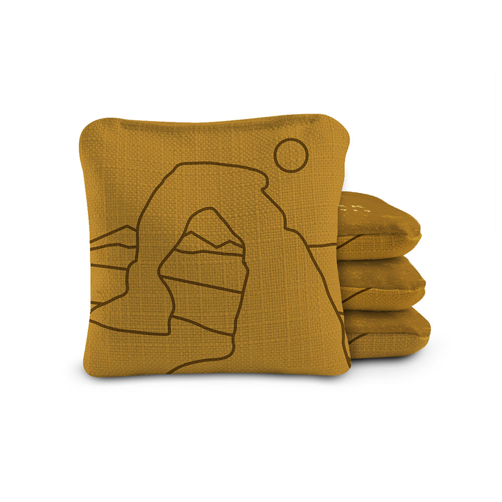 Mustard yellow fabric with a mountain design on a white background