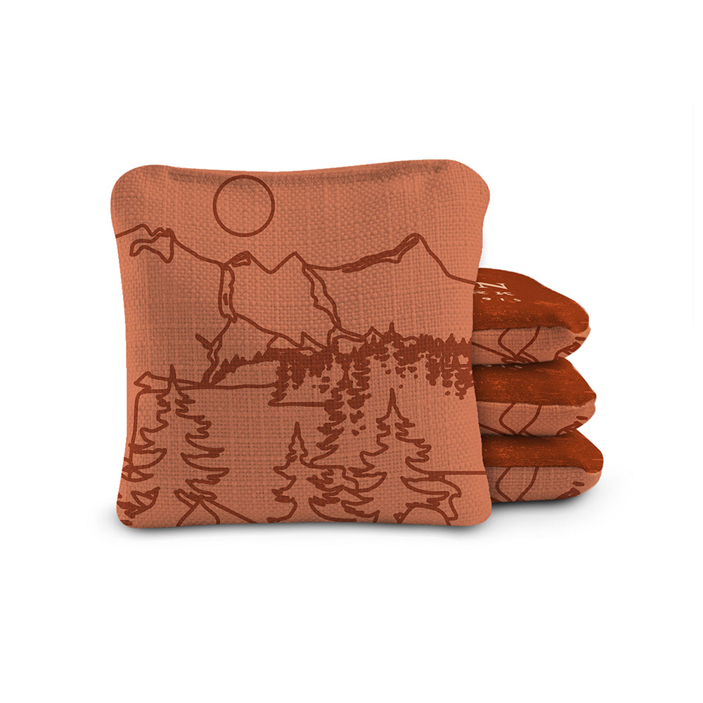 Set of three brown coasters with nature-themed designs on a white background
