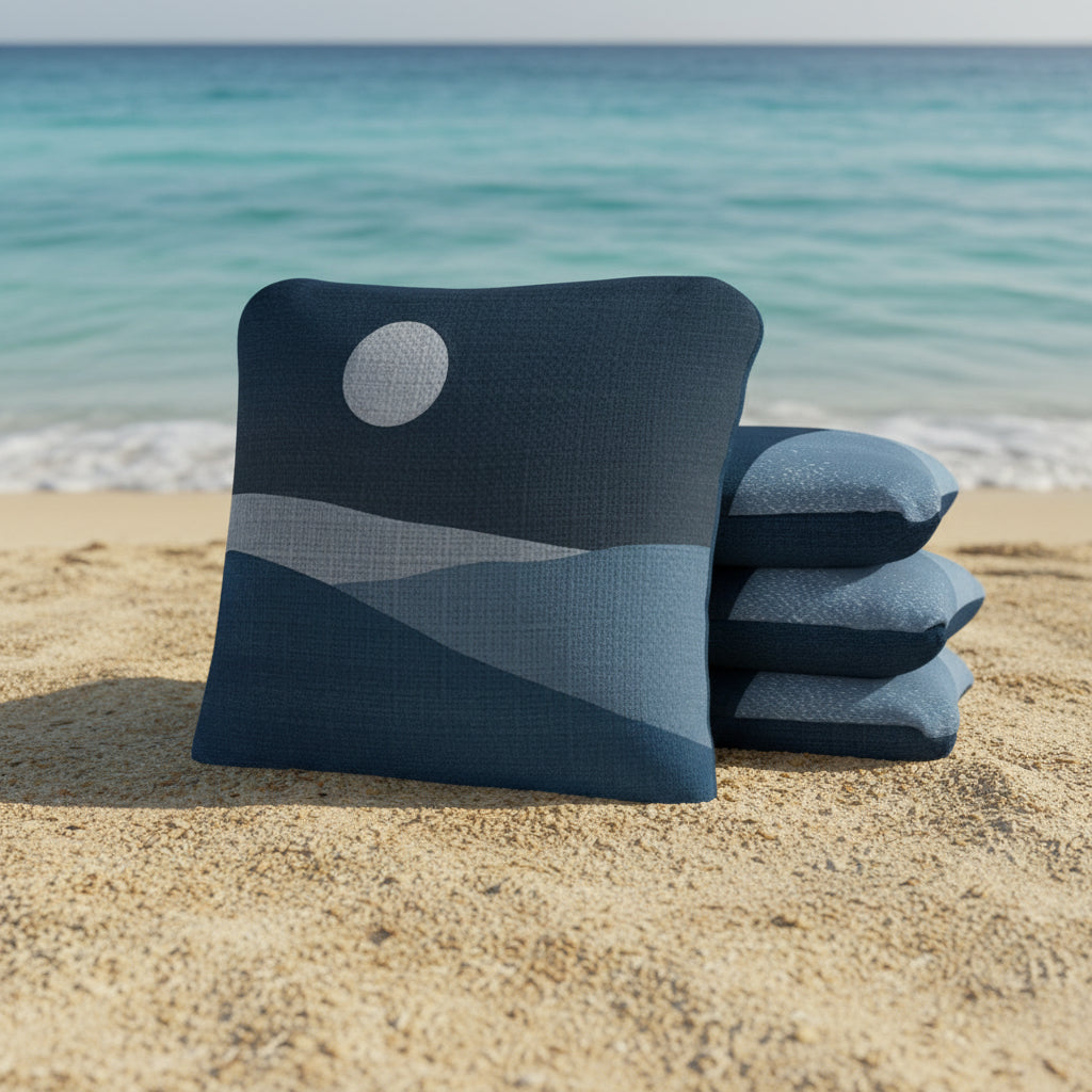 Stack of blue pillows with a moon design on a white background