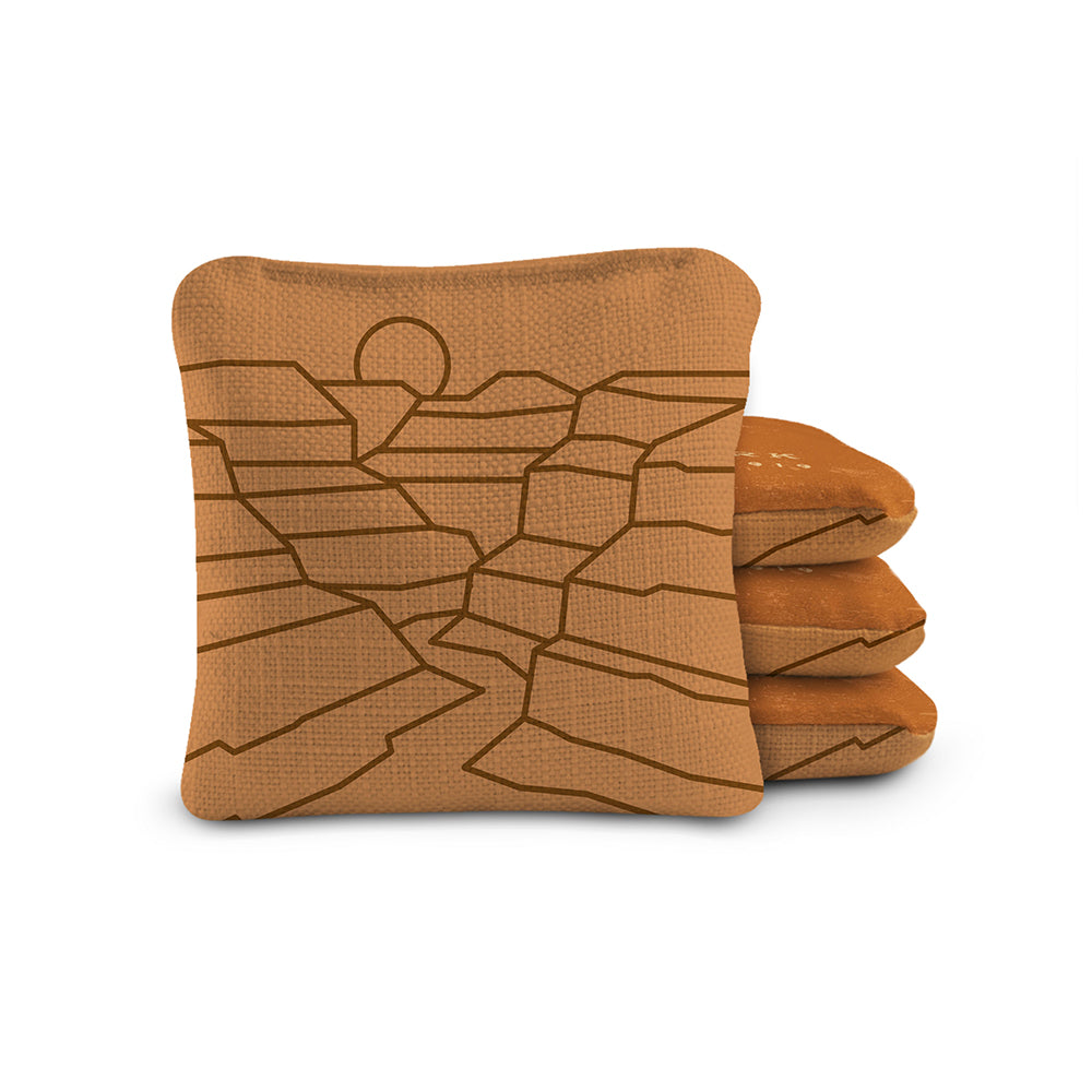 Folded brown blanket with geometric pattern on a white background