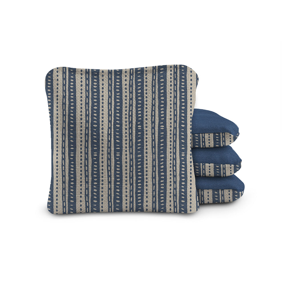 Pair of blue and gray patterned oven mitts on a white background
