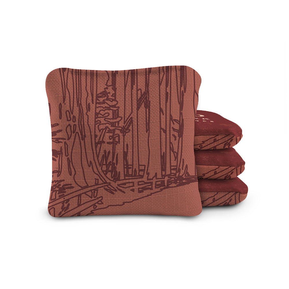 Stack of brown towels with a forest design on a white background