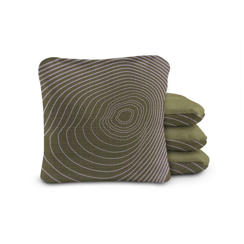 Green pillow with concentric circle pattern on a white background