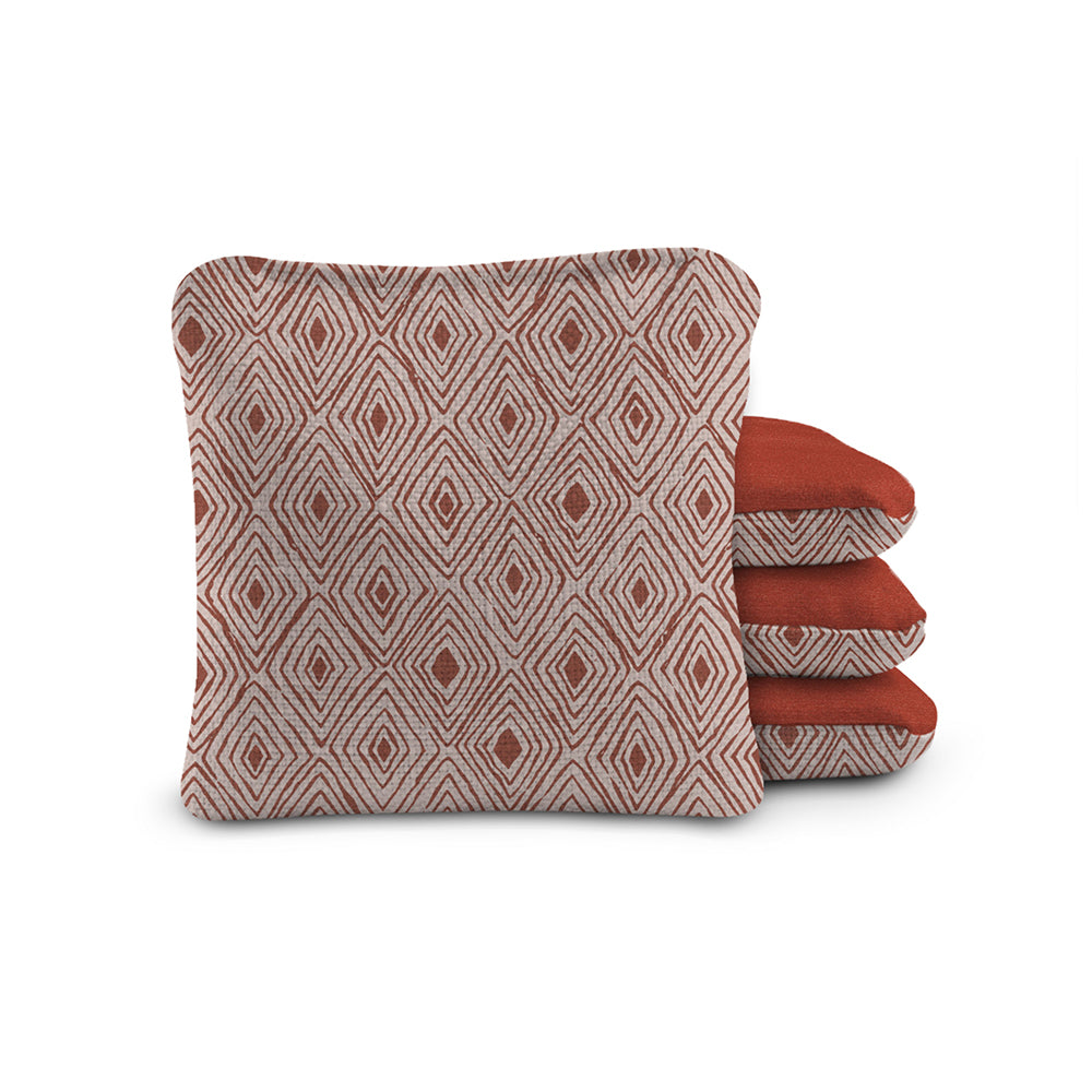 Set of three patterned cushions on a white background