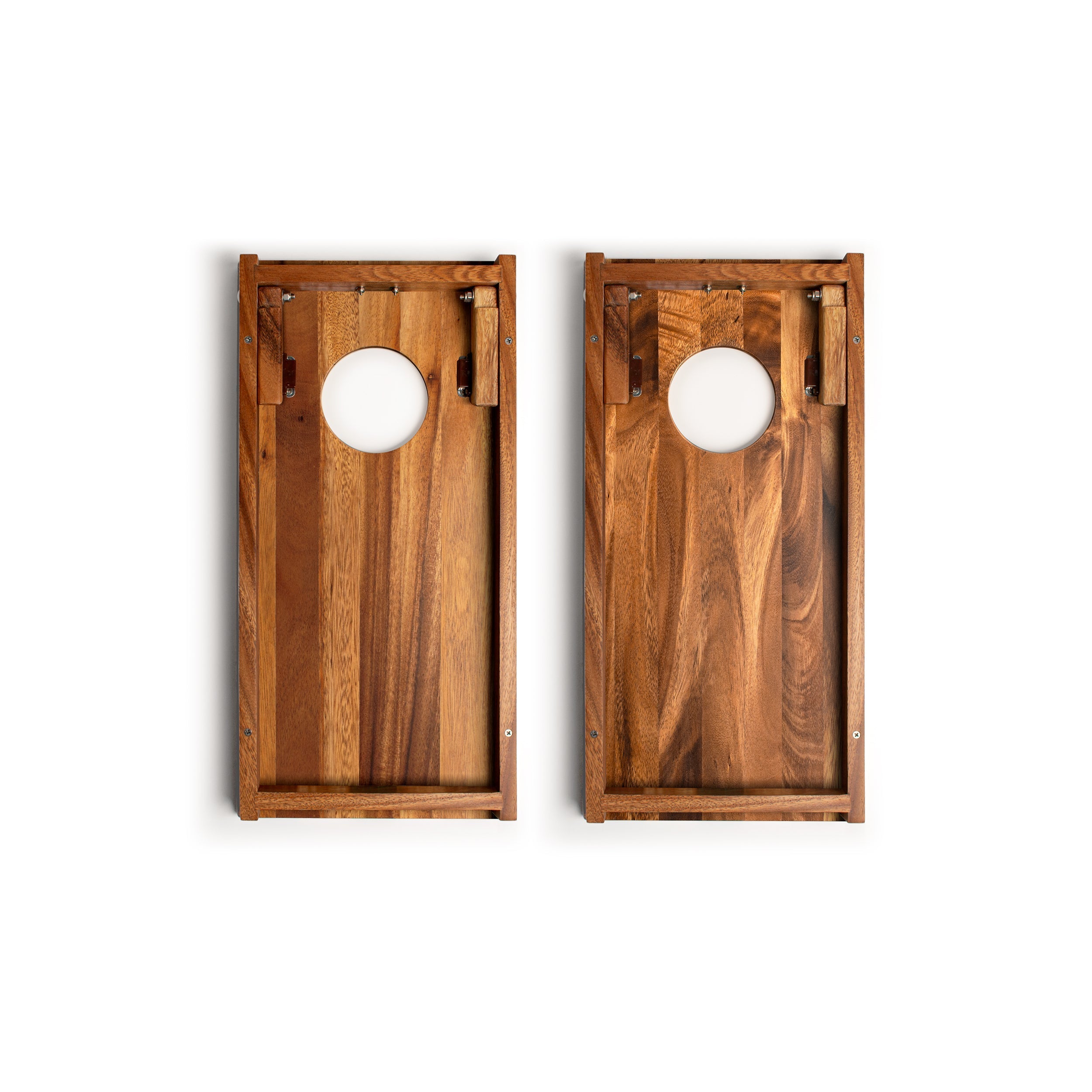 Two wooden cornhole boards with a white background