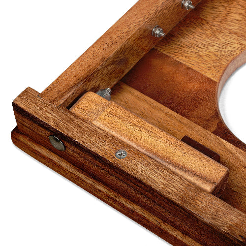 Close-up of a wooden tray with a white dish on a white background