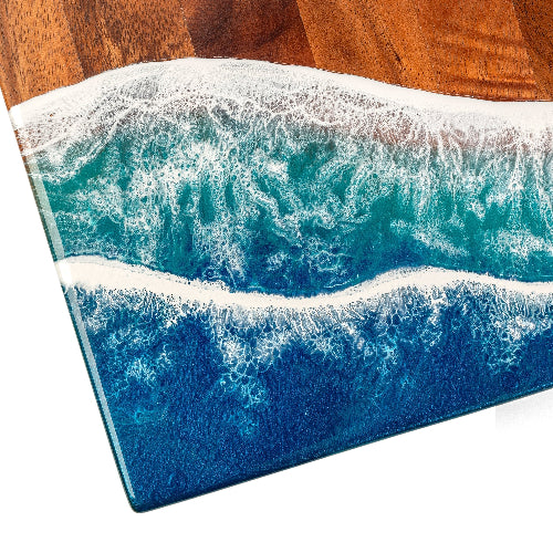 Artistic depiction of ocean waves on a wooden surface