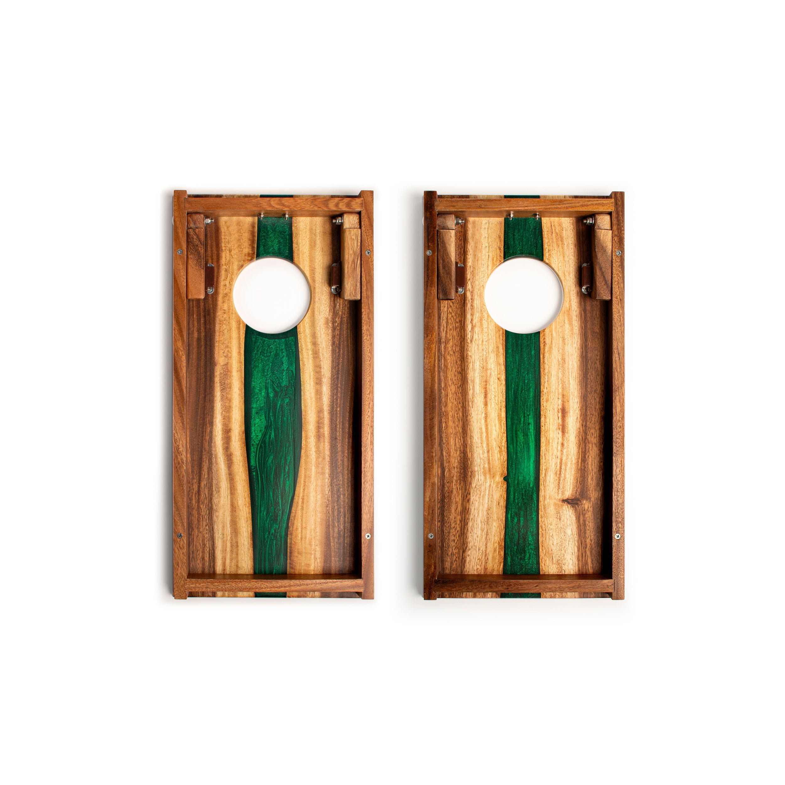 Two wooden cornhole boards with green and brown stripes on a white background